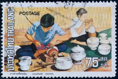 THAILAND - CIRCA 1980: a stamp printed by Thailand, shows Silverware making, circa 1980のeditorial素材