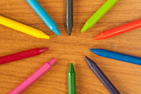 wax crayons on wood tableの写真素材