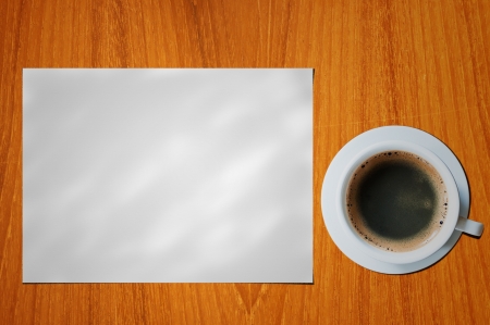 blank paper with coffee cup on wood tableの写真素材