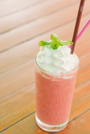 strawberry smoothie on outdoor tableの写真素材