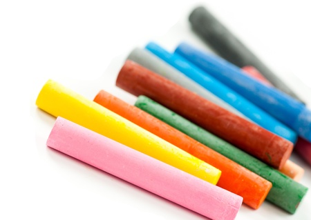 colorful oil pastels isolated on white, closeup shot