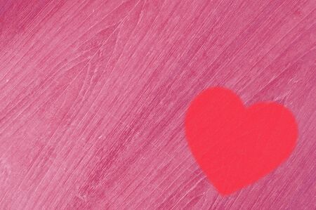 red heart on pink wood backgroundの写真素材