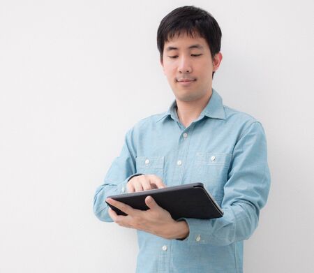 asian man touching tabletの写真素材