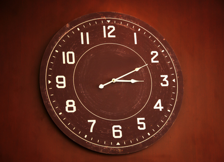 wooden clock on wallの写真素材