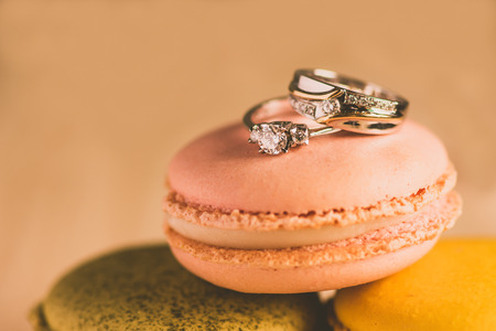 macarons with wedding rings close up shot, retro filterの写真素材
