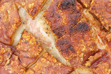 Close up view of rustic cooked pork meat on firewood.の写真素材