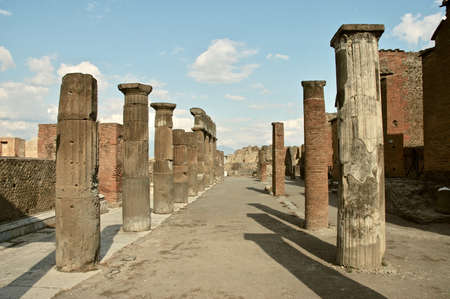 Roman street with columns in the city of Pompeii. The eruption of Vesuvius left the columns intactの写真素材