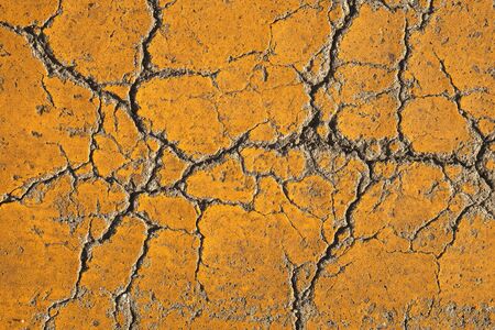 Cracked yellow concrete road