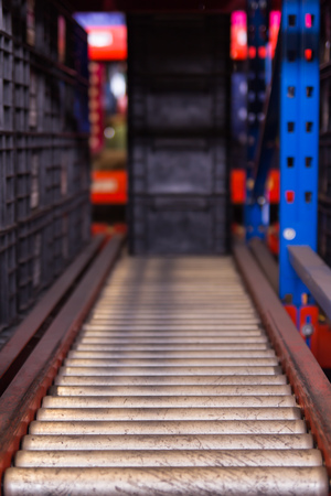 Conveyor rollers transport system for crates in factoryの写真素材