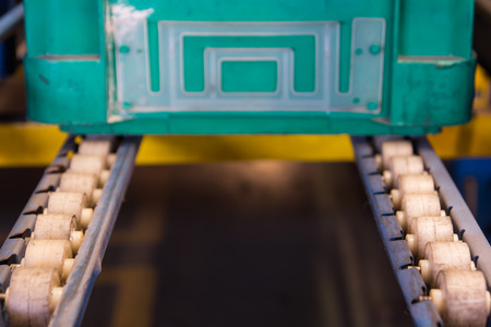Conveyor rollers transport system for crates in factoryの写真素材