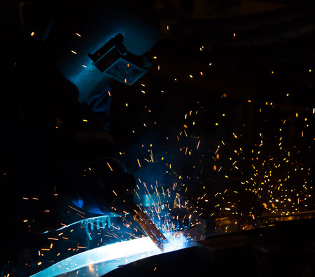 Team work is welding skills up. Manufacturing of car.