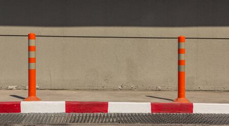 Red and white pole warned not to enter the area.の写真素材