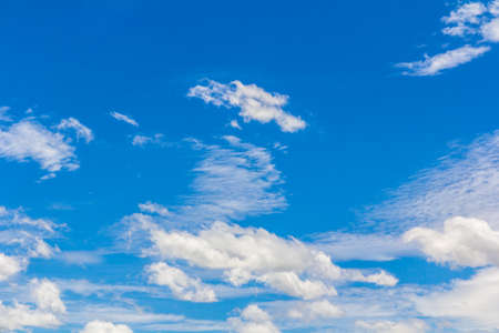 Sky background with the fluffy white cloudsの写真素材