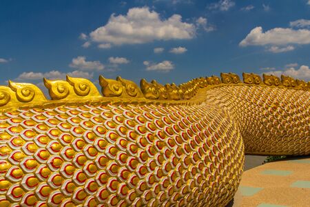 The Big scaly Naga snake guarding Thai templeの写真素材