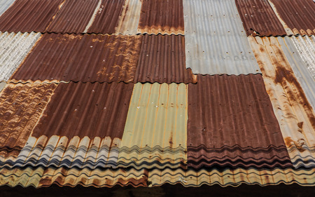 Wooden house tin roof ,Old Thai style wooden house with rusty zinc roofの写真素材