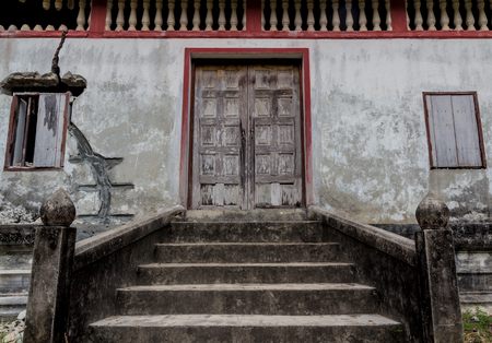 Old weathered wooden window with hingesの写真素材