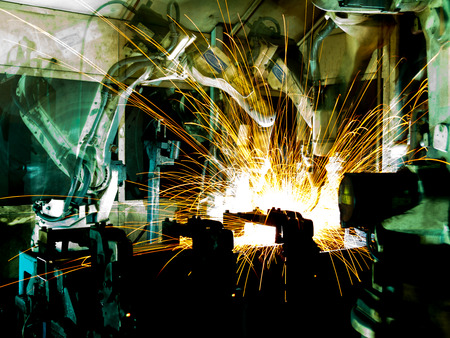 Team welding robots represent the movement. In the automotive parts industry.の写真素材