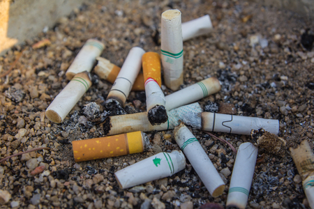 Bad addiction. Ashtray and cigarettes close-up.の写真素材