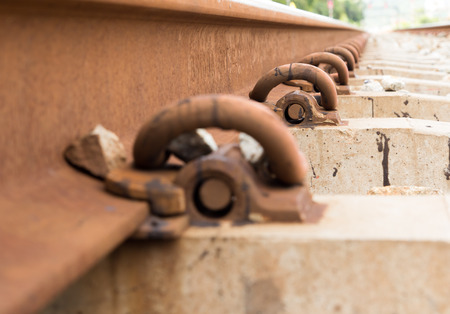 Straight-line railway tracks on the gravel with realistic rusty rails