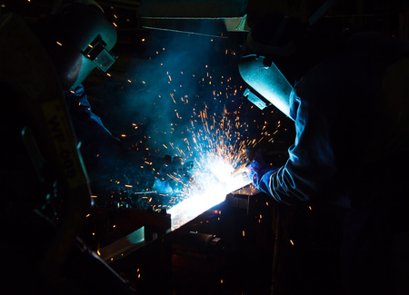 Team work is welding skills up. Manufacturing of car.