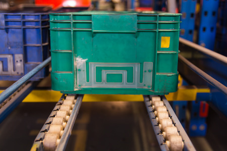 Conveyor rollers transport system for crates in factoryの写真素材