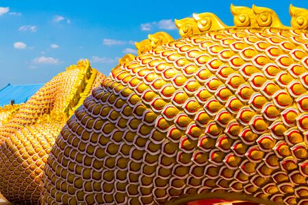 The Big scaly Naga snake guarding Thai templeの写真素材