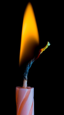 Burning candles on black backgroundの写真素材