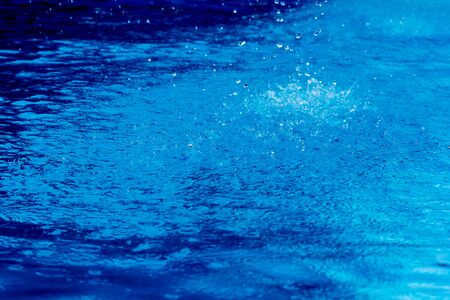 Water droplets and spray, blue water splashの写真素材
