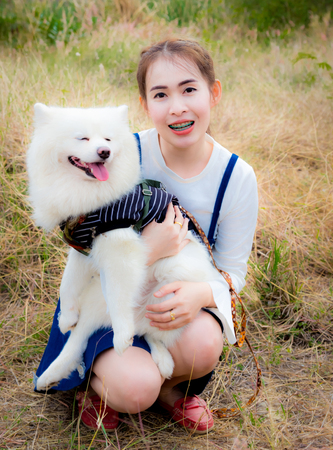 Little girl with cute little dogの写真素材