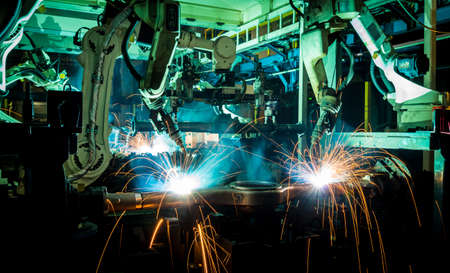 Industrial welding robots represent the movement in the automotive parts industry.の写真素材