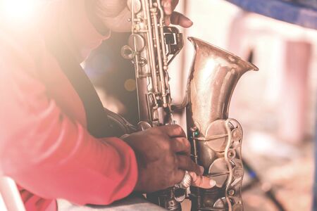 Musical instruments,Saxophone Player hands Saxophonist playing jazz music. Alto sax musical instrument closeupの写真素材