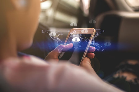 download,Closeup hand of woman with Cloud download on mobile smartphone.の写真素材