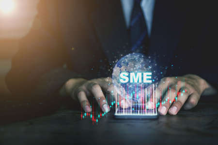 SME (or small and medium enterprises) signed with the icon network on business phoneの写真素材