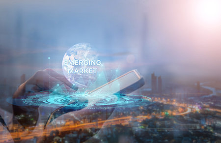 Emerging markets. Internet and network technology business concepts. businessman on smart phone Work on the futuristic virtual screen and see the inscription.Element of this image furnished by Nasaの写真素材