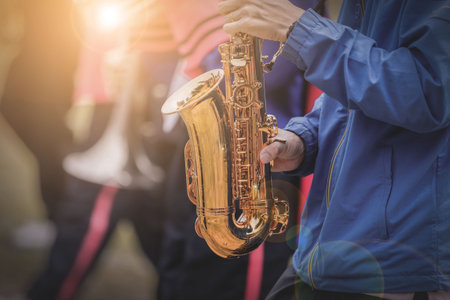 Musical instruments in a marching band, saxophone playing hands, saxophone playing jazz. Alto saxophone, musical instrument, close-up.の写真素材