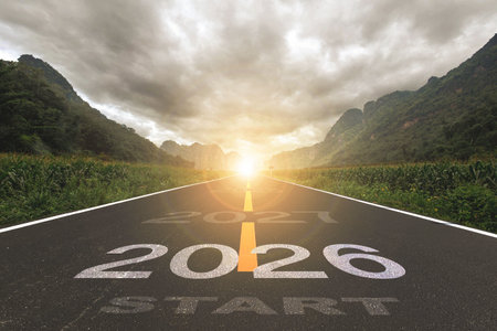 the new year or the beginning of the concept of the word, written on a road in the middle of a paved...