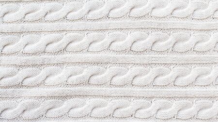 Knitted Christmas and New Year holiday beige background