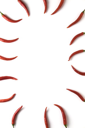 Red hot little chili peppers pattern with copyspace isolated on white background. Top view. Flat lay.の写真素材