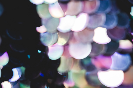 Shiny abstract background of semicircular multi-colored plastic elements of sequins texture fashion....