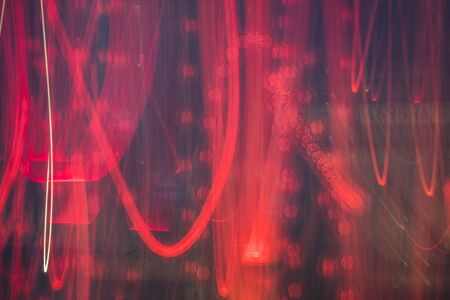 Abstract bright blurred neon trend background, multi-colored lines. Speed light beam night traffic and lights.の写真素材