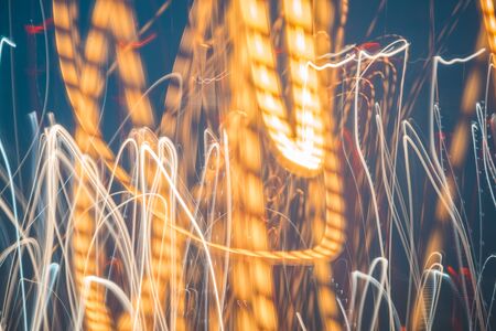 Abstract bright blurred neon trend background, multi-colored lines. Speed light beam night traffic...