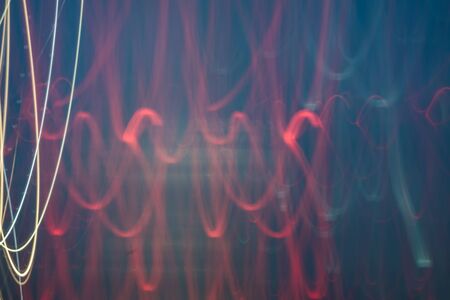 Abstract bright blurred neon trend background, multi-colored lines. Speed light beam night traffic...