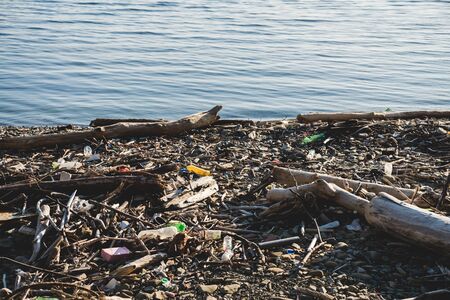 Ecological concept. Ecology problems of the planet Earth. Rubbish in places of rest by the sea.の写真素材