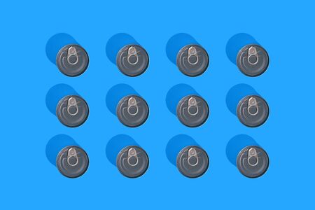 Tin can top view on blue background with hard shadow. The concept stocks of products during...