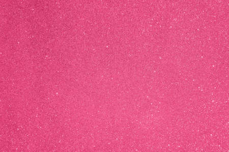 Abstract glitter blurred shiny raspberry pink background. Bright sparkling bokeh wallpaper style. Festive Christmas holiday futuristic texture.の写真素材
