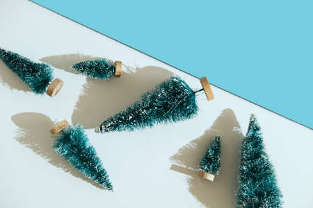 Toy plastic green tree on white and blueの写真素材