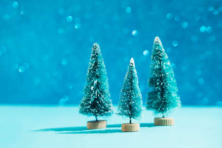 Christmas minimal festive background with christmas toy tree. Abstract glitter blurred background...