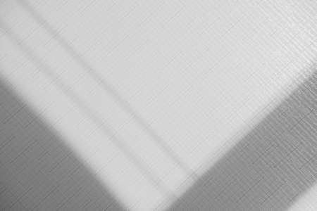 Gray shadow overlay on a light text background. Minimal texture.の写真素材