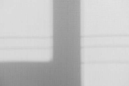 Gray shadow overlay on a light text background. Minimal texture.の写真素材