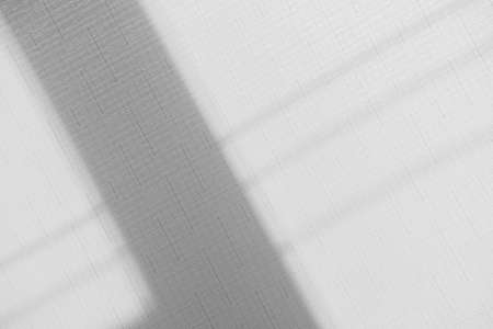 Gray shadow overlay on a light text background. Minimal texture.の写真素材